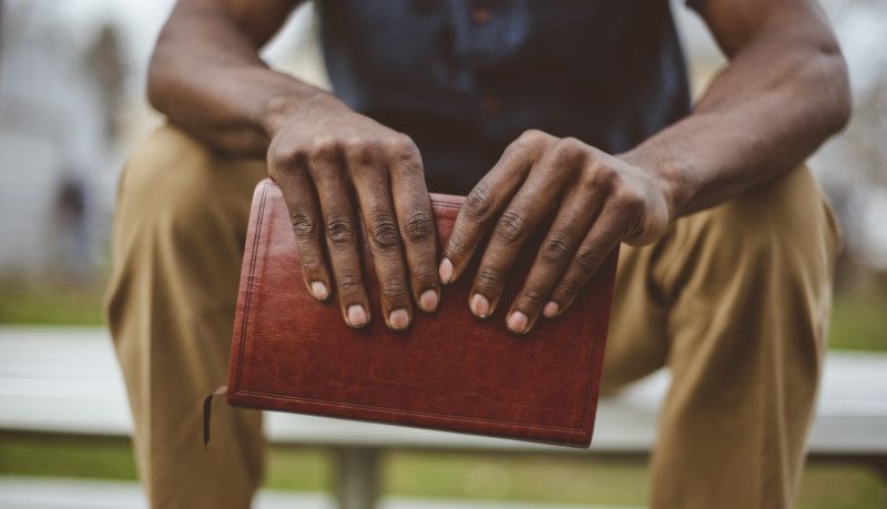 Man holding a bible